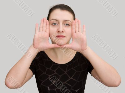 Hands near the face.