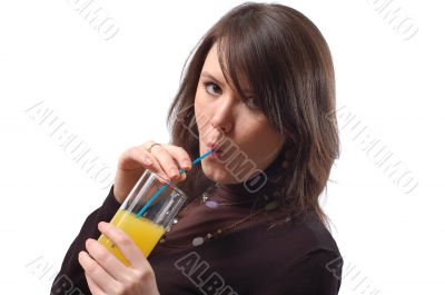The girl drinks juice