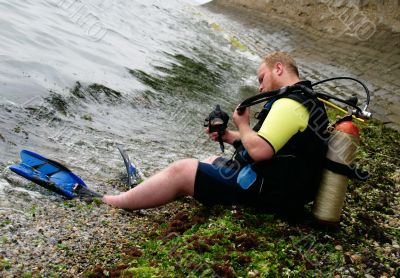 Diver on a beach after submergence
