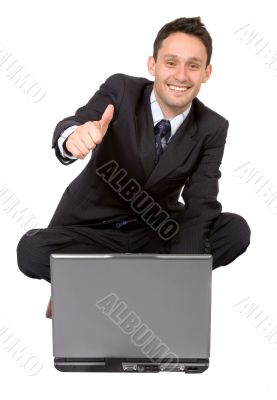 business man on laptop with thumbs up