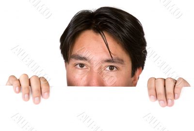 latin american man peeping over white card