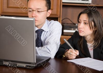 business partners on a laptop