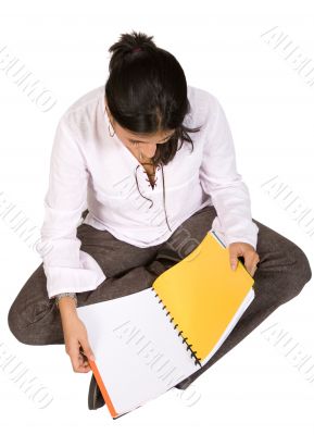 beautiful student studying on the floor