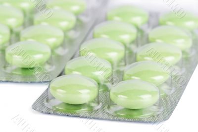 blister package of green pills isolated