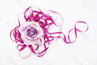 violet artificial rose convoluted in purple tape 1