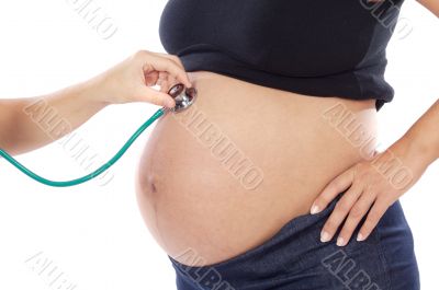 Pregnant examined by a doctor