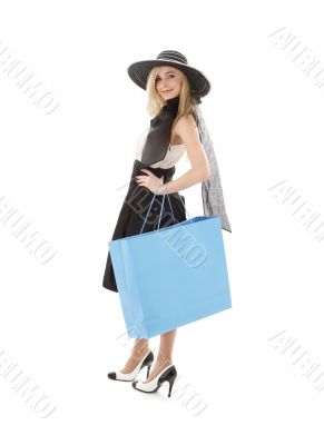 blond in retro hat with blue shopping bag 3