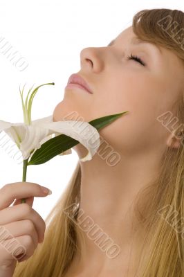 young girl smelling lily