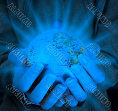 Globe in a girl`s hands