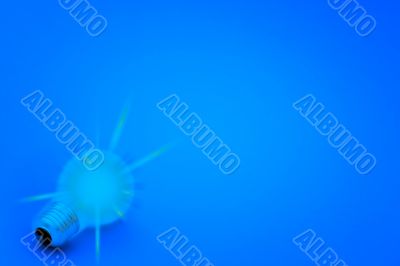 Background with lit lightbulb