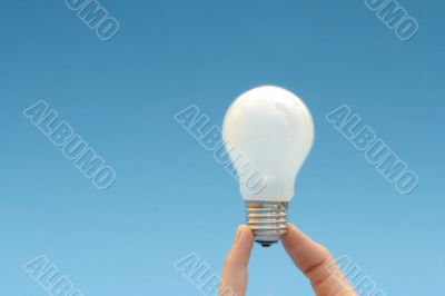 Background with lit lightbulb