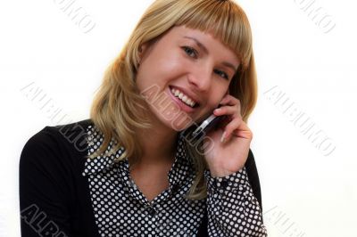 young woman with mobile phone is smiling in office