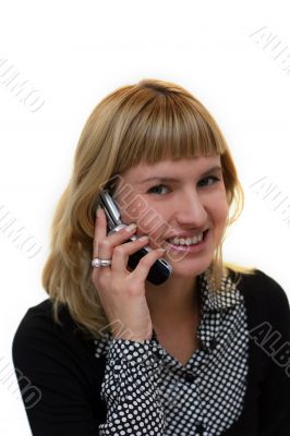young woman with mobile phone is smiling in office