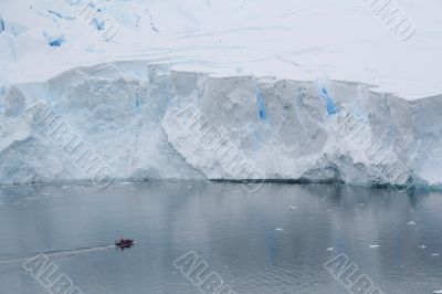 Glacial walls with polar landing boat