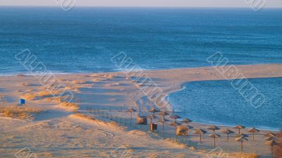 umbrellas on a desolated seabeach