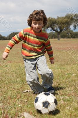 Child playing football