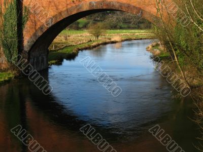 river flowing under the bridge