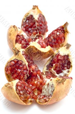 ripe pomegranate on white