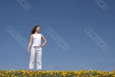 Young woman in flowering field