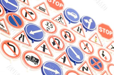Toy road sign on white