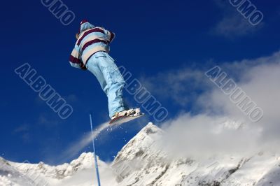 Snowboarder jumping high in the air