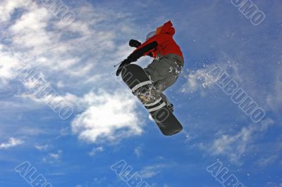 Snowboarder jumping high in the air