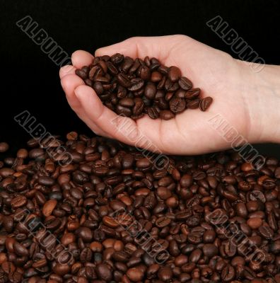Hand holding coffee