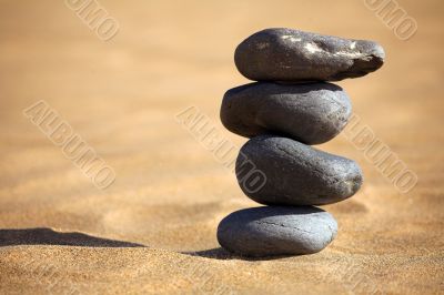 balancing stones on a beach
