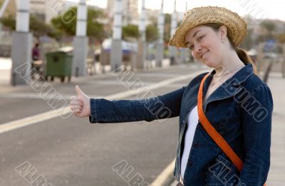 girl hitchhiking on the street