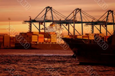 cargo boat by the beach at sunset