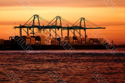 Cargo ship at sunset