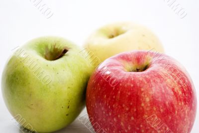 three apples of different colours