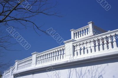 White balcony under blue sky