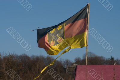 German flag on a background of the sky.