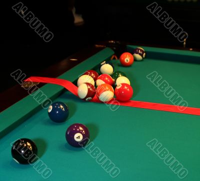 Photo of pool table and balls