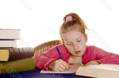 young girl is studying the books