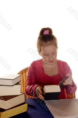 young girl is reading a studybook