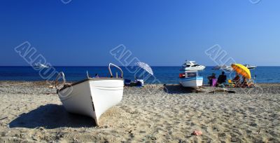 boats and people on the beach