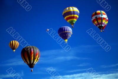Hot air balloons agaisnt blue sky