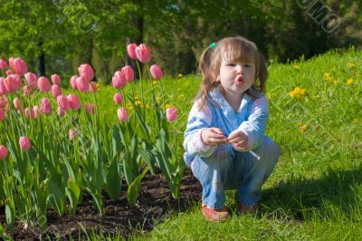 Girl near tulips