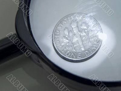magnifier and coin