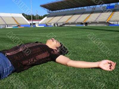 Relaxing on a stadium grass
