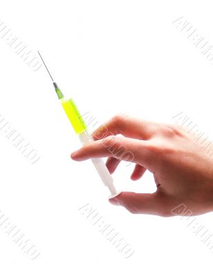 Hand holding a syringe