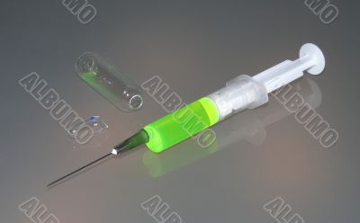 Syringe and a broken ampule