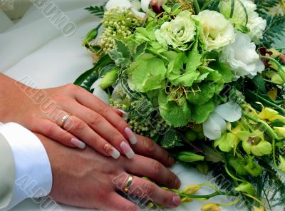 Wedding rings and bouquet