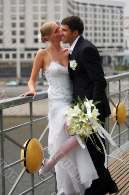 Kissing newlywed couple