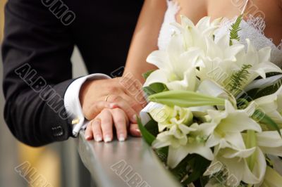 Bride and Groom holding hands