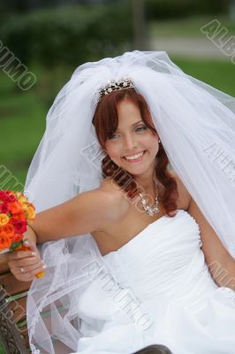 Beautiful smiling bride in white
