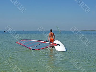 The guy drags the windsurf