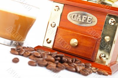 Cup, grinder, coffee pot and beans